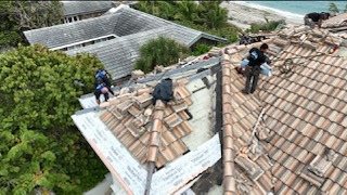 Mike McGilvary Roofing crew rebuilding a failed roof section on the Highland Beach estate