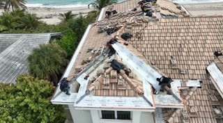 New waterproofing underlayment and tile reinstallation during the roof restoration