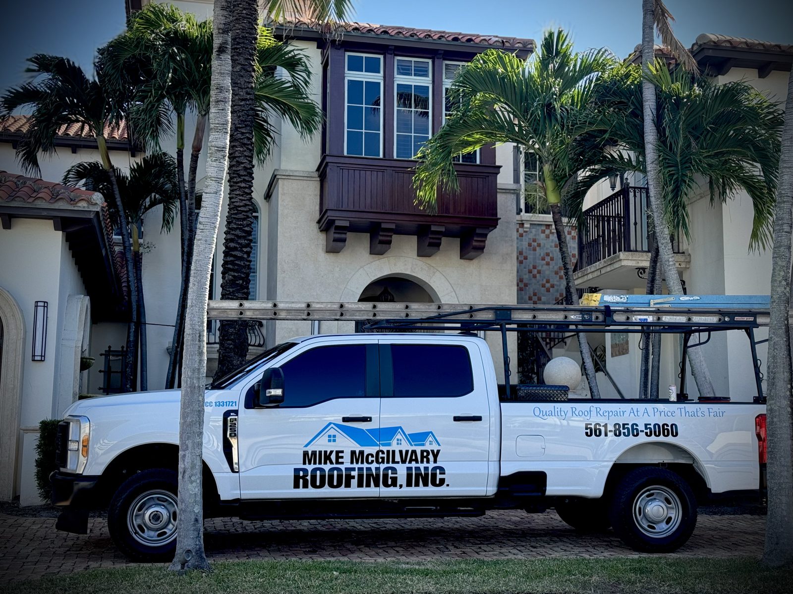 A Mike McGilvary Roofing truck on a Palm Beach County job