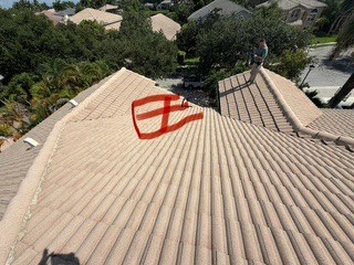 The failing roof section outlined in red at Barletta Winds Point, Delray Beach