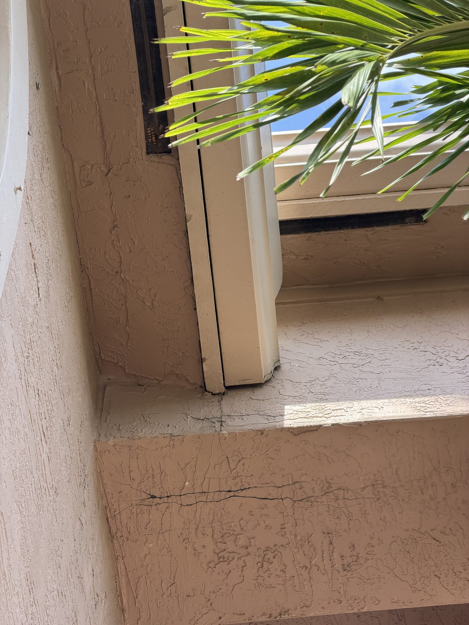 Close-up of fascia cracking near the roofline at Barletta Winds Point, Delray Beach