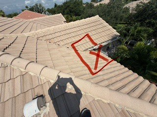 A failing high-water-flow roof area marked during the Barletta Winds Point inspection, Delray Beach