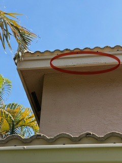 A localized tile failure area circled during the Barletta Winds Point inspection, Delray Beach