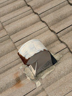 A roof vent needing new mortar and corrosion treatment at Barletta Winds Point, Delray Beach