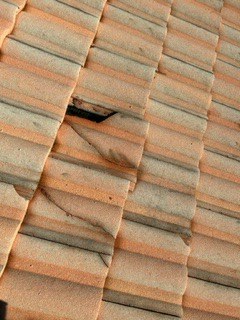 A damaged roof tile at Canoe Shore Way, Delray Beach