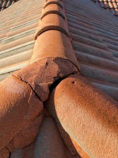 A loose ridge cap needing refastening at Canoe Shore Way, Delray Beach