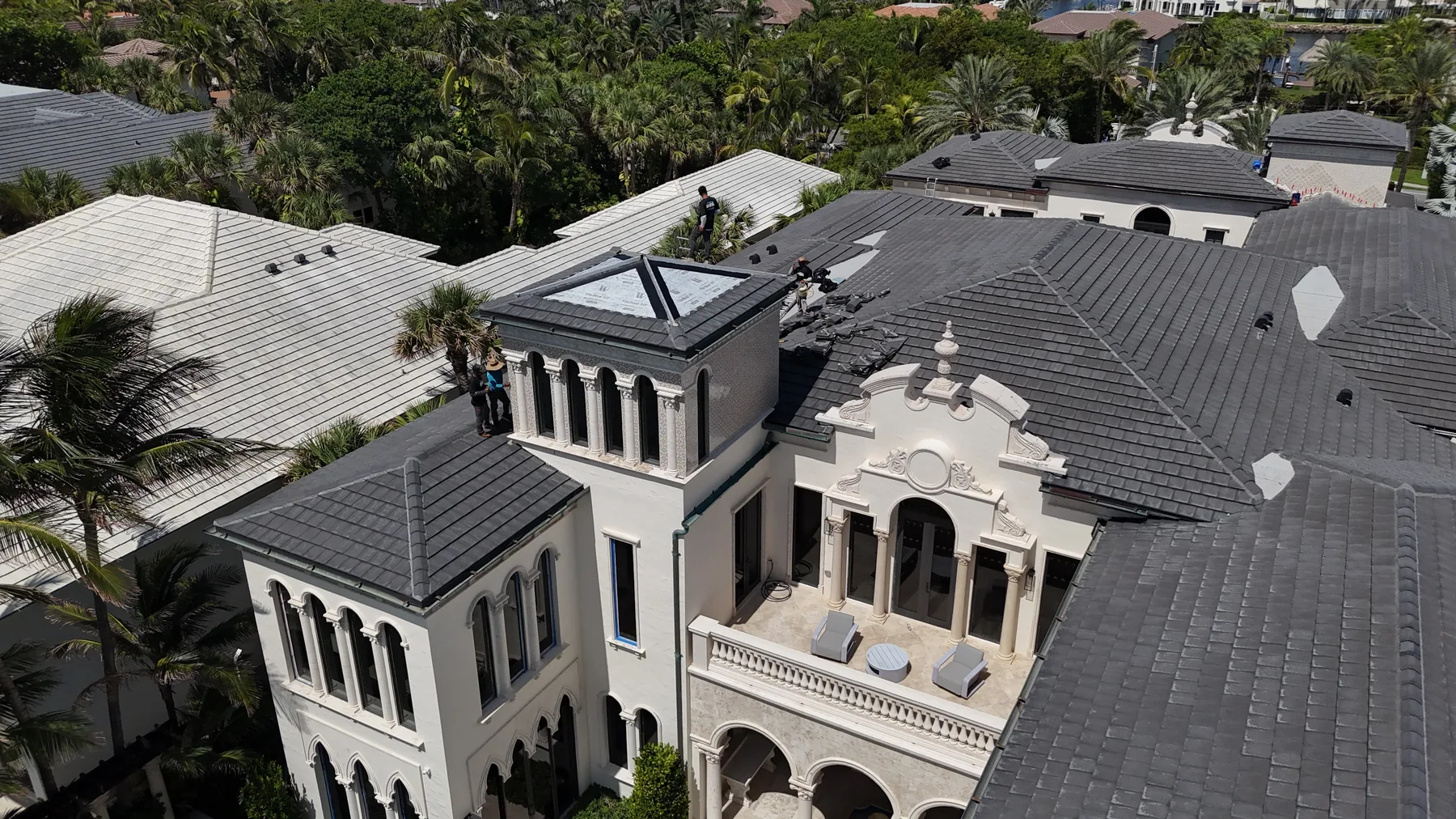 Mike McGilvary Roofing performing targeted tile roof reconstruction on the Delray Beach oceanfront estate