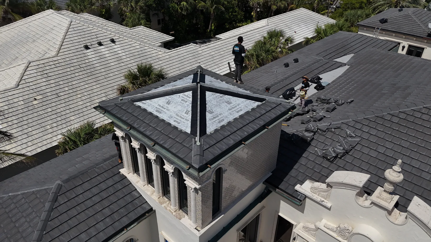 Concrete tiles removed to expose and rebuild the roof underlayment section on the Delray Beach oceanfront estate