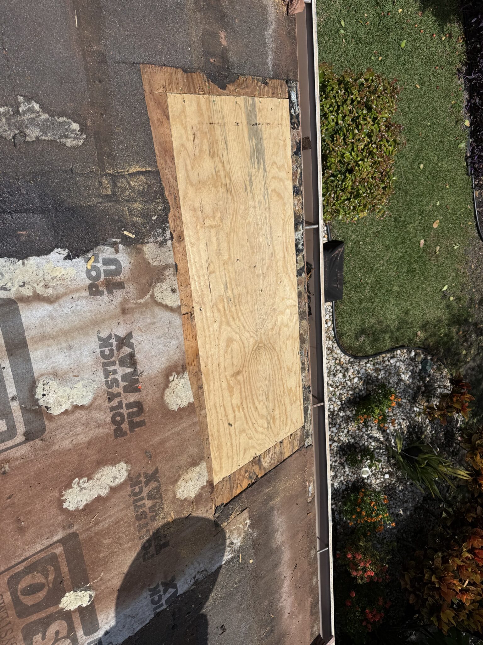 New plywood decking installed to replace rotted wood on a tile roof