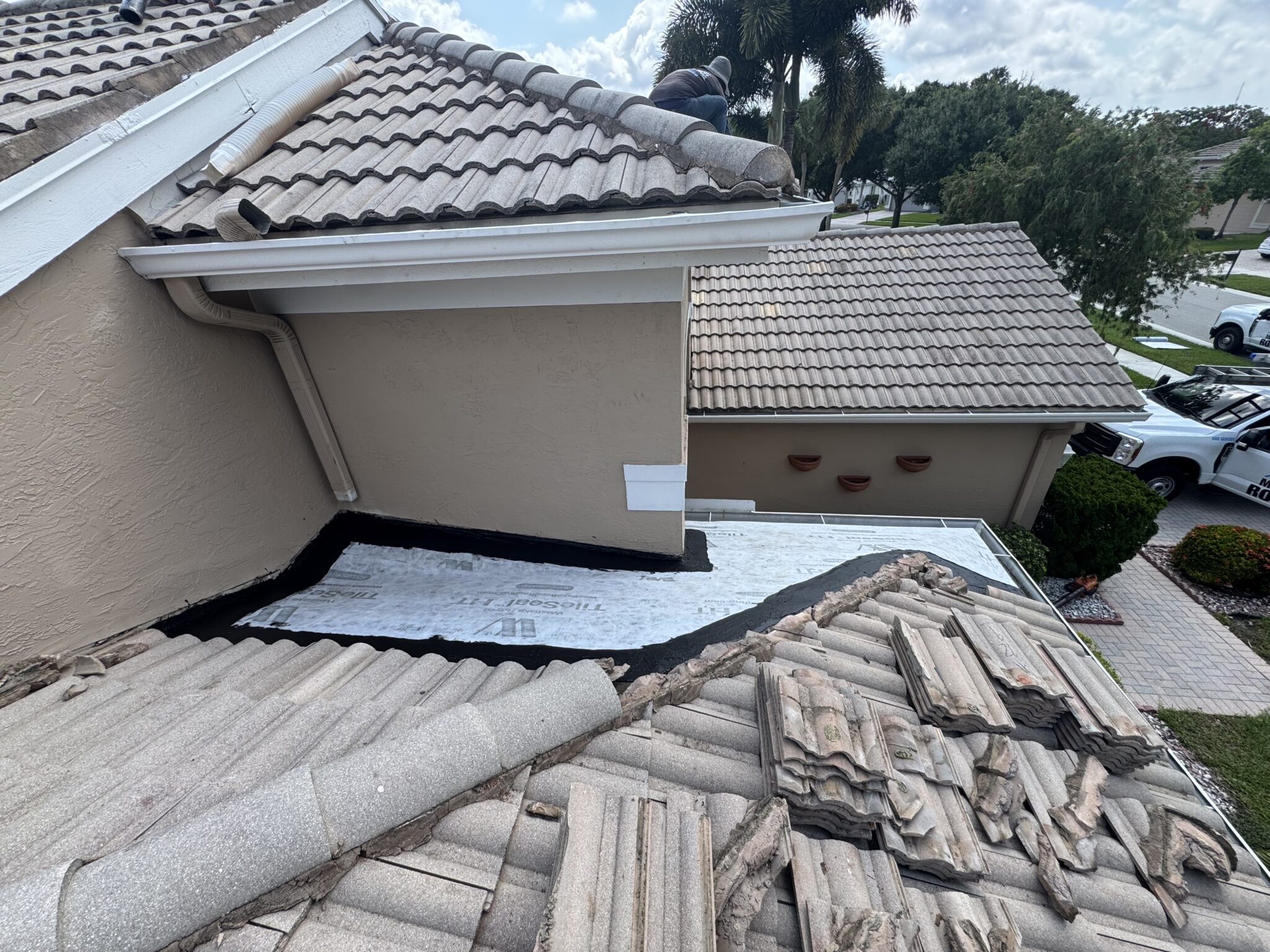 New self-adhered underlayment installed across a rebuilt tile roof section in Delray Beach