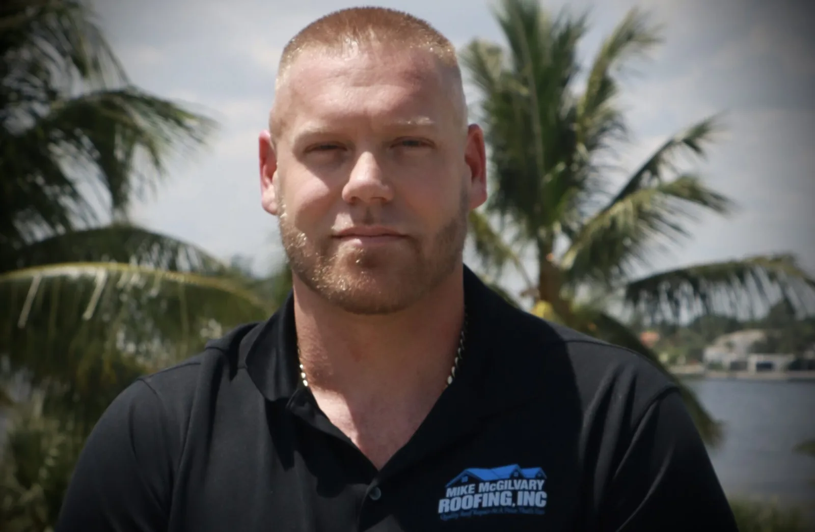 Mike McGilvary, owner of Mike McGilvary Roofing, in a company polo on the Palm Beach County waterfront
