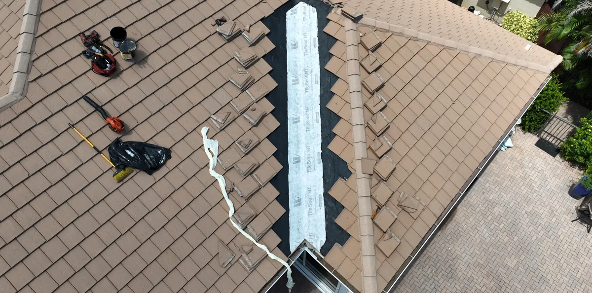 New underlayment run along a hip of the tile roof during the repair