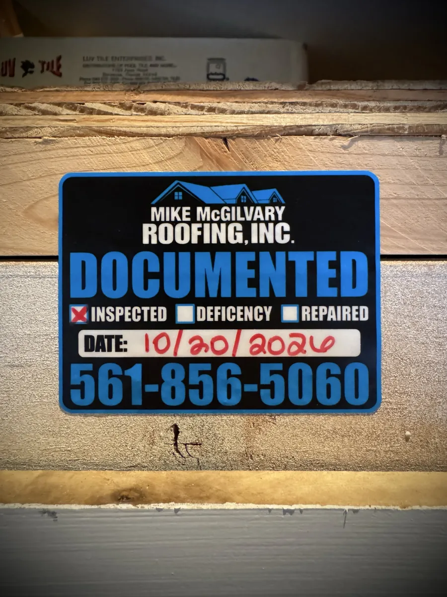 Mike McGilvary Roofing Documented inspection tag on attic lumber, marked inspected and dated October 20, 2026.