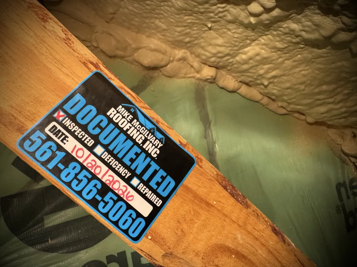 Mike McGilvary Roofing Documented tag on an attic truss, with the Inspected box checked and the date 10/20/2026 written in.