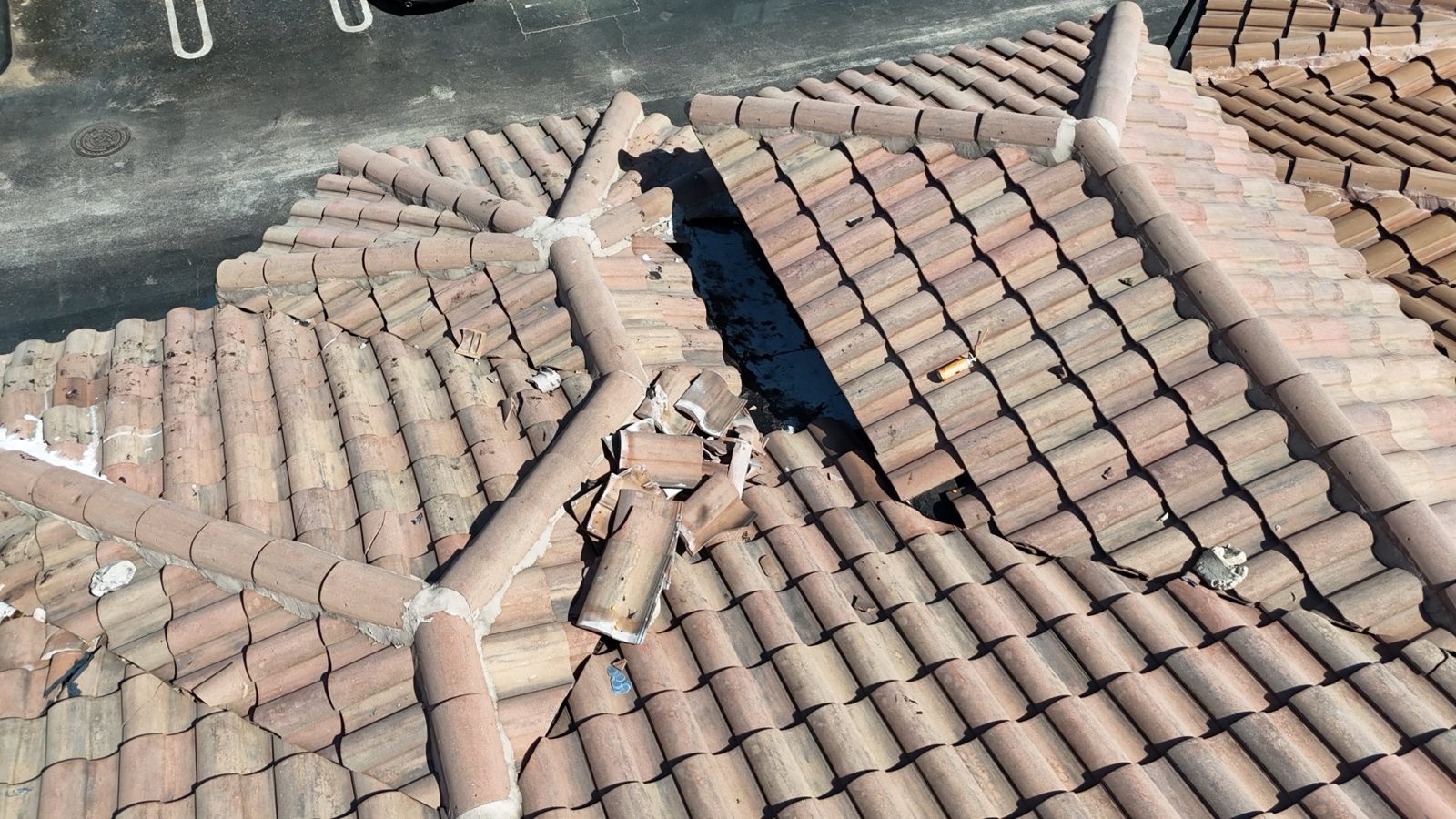 Loose broken roof tiles left on a tile roof