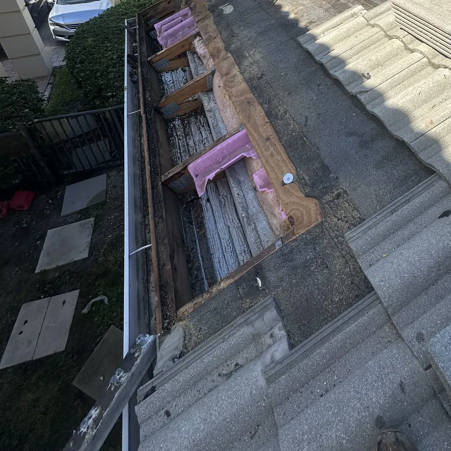 Stage 2: the same section with the rotted plywood removed, down to the roof framing.