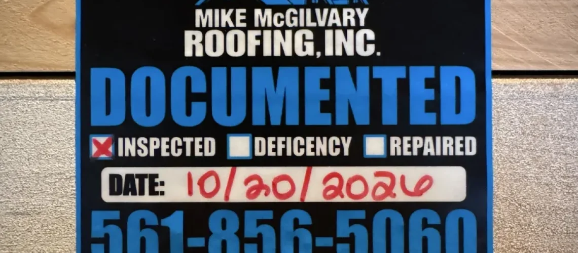 Mike McGilvary Roofing Documented inspection tag on attic lumber, marked inspected and dated October 20, 2026.