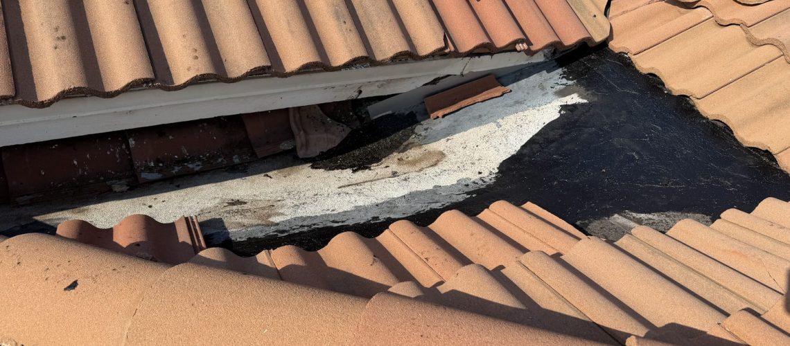 Open tile roof section with exposed decking during the Barletta Winds Point roof inspection in Delray Beach
