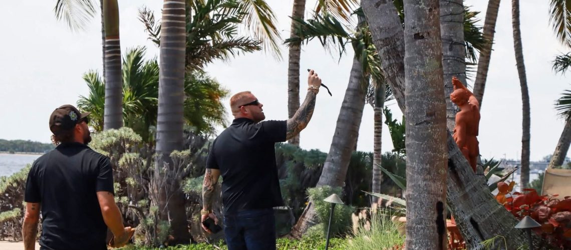 Licensed Florida roofing contractor Mike McGilvary inspecting a waterfront tile roof in Palm Beach County.