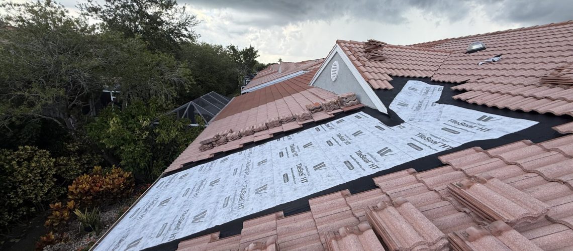 New self-adhered underlayment across a full tile roof repair section