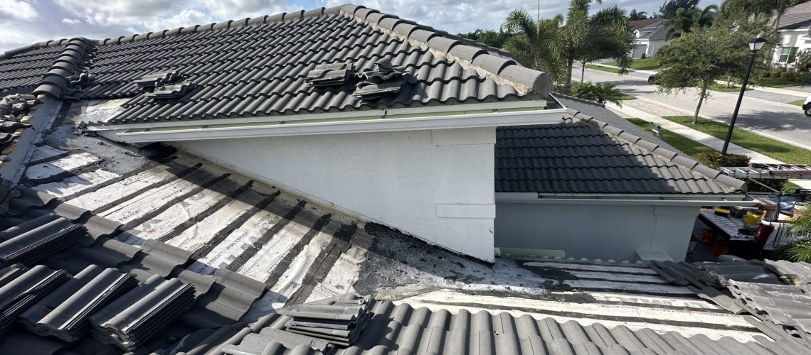A concrete tile roof section opened during a repair