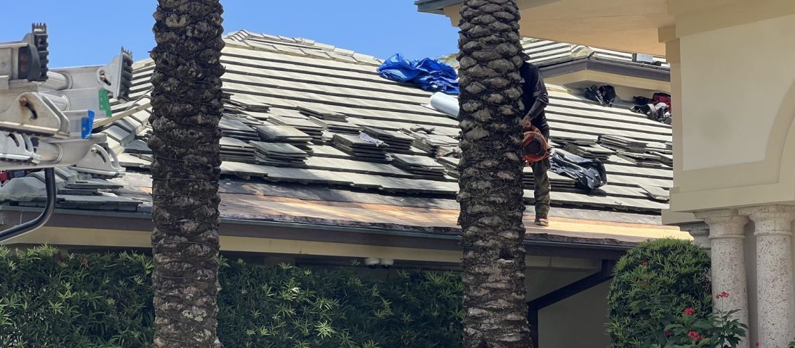 The crew working on a tile roof at a Palm Beach County home